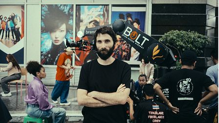 Not To Scale signs director Jovardi