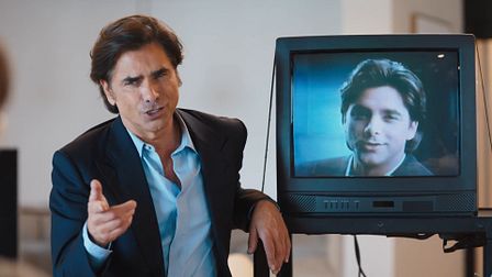 John Stamos looks for a Pantene hair extension